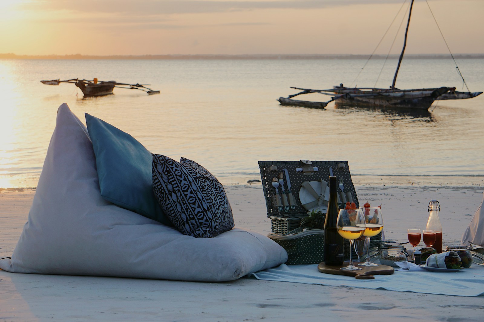Zanzibar Beach Insights 3 a couple of pillows sitting on top of a sandy beach
